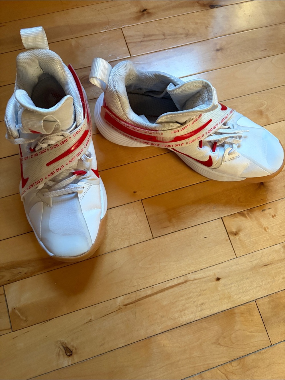 Nike React HyperSet volleyball shoes in white and university red.